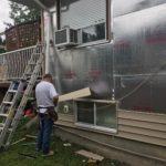 Stefan working on vinyl siding installation