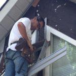 Stefan working on window and siding