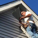 Stefan working on vinyl siding