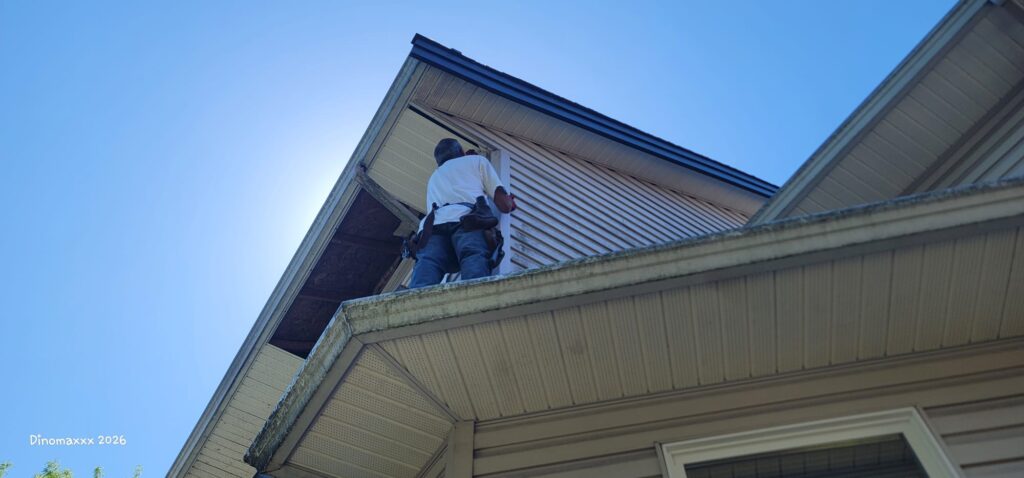 Stefan working on soffit repair for soffits damaged by nesting birds.