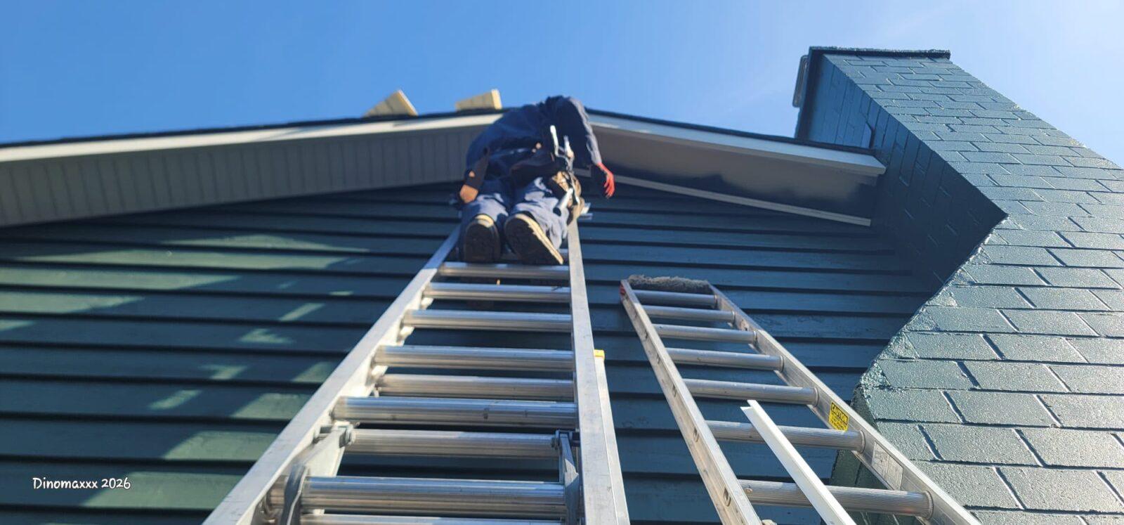 Stefan from Sunny Exteriors on ladder replacing soffits